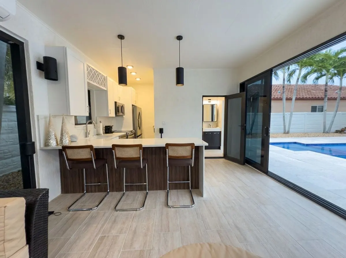 West Kendall pool house — full kitchen and bar seating interior