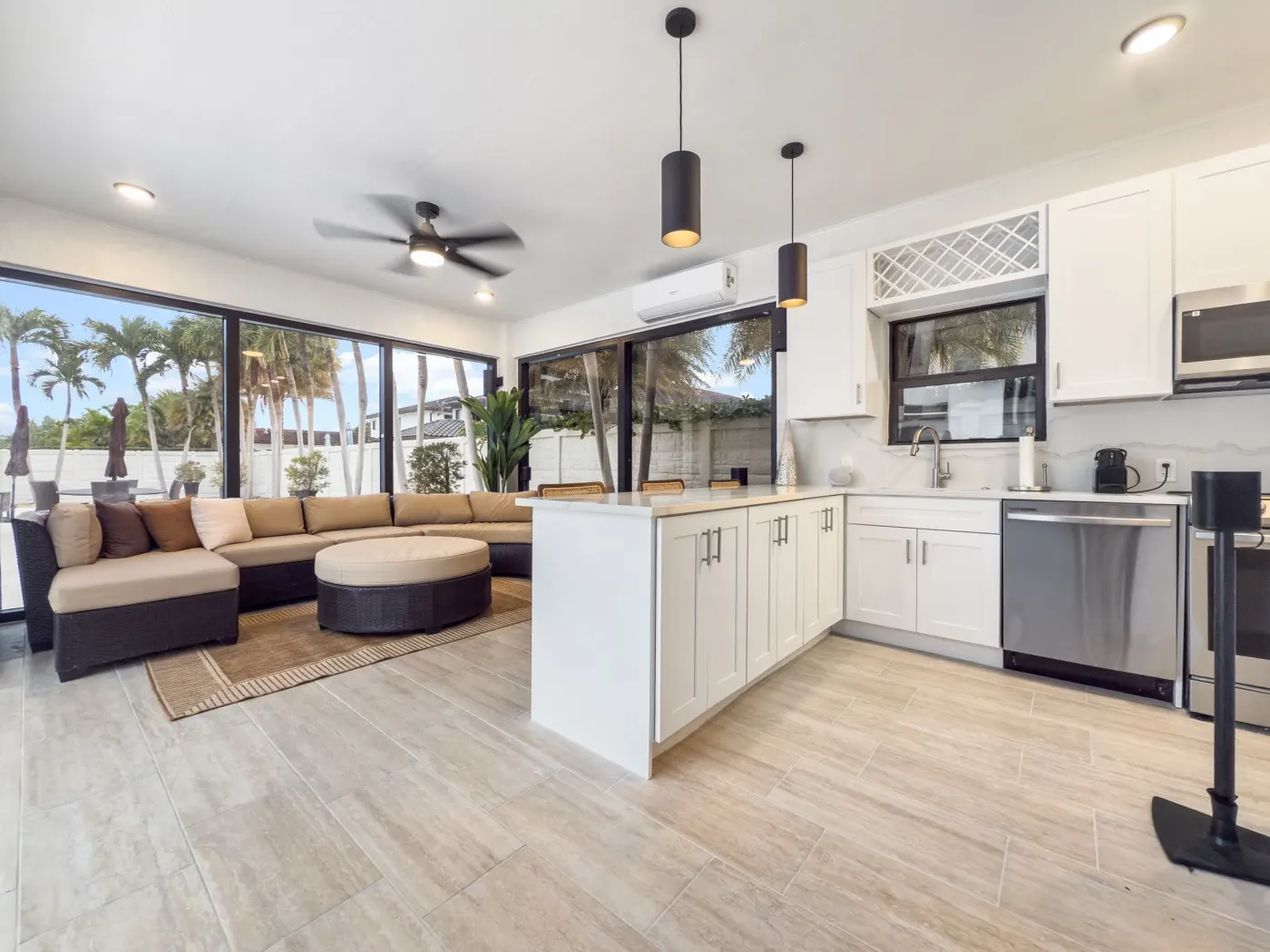 West Kendall pool house — exterior with barrel-tile roof and pool-deck sliders