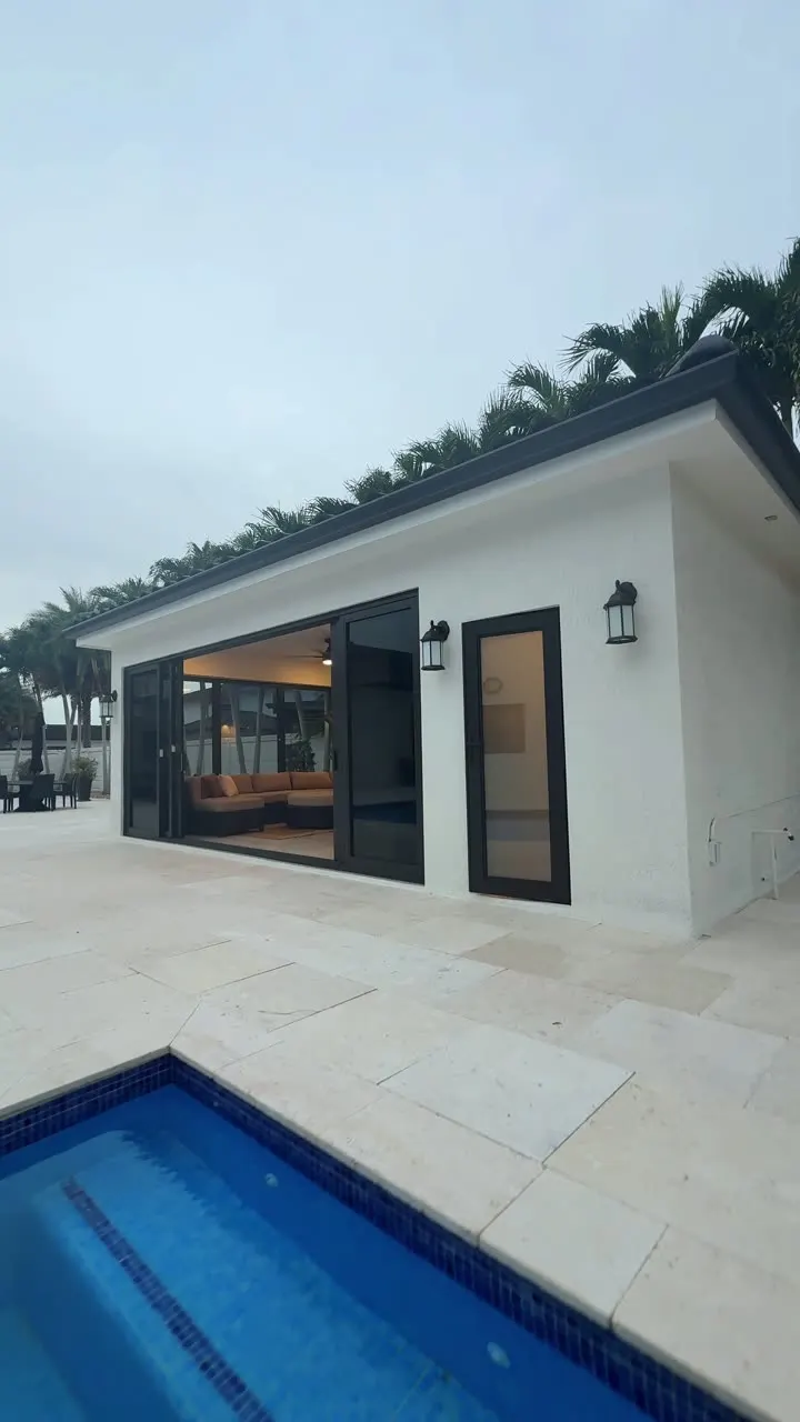 West Kendall pool house — finished cabana with full kitchen, bar seating and pool-side impact sliders